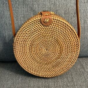 Rattan circle bag with floral interior